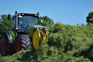 Tractor working with forage